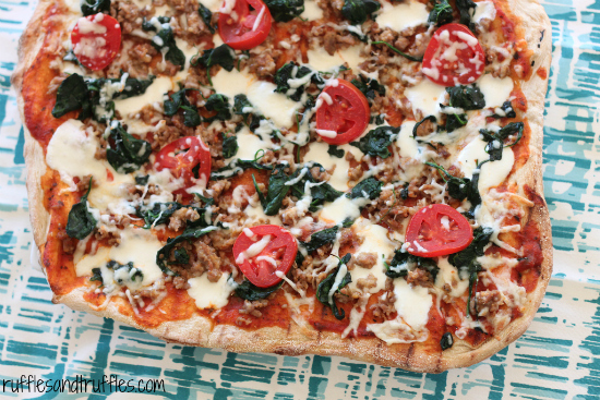 grilled pizza with sausage and spinach