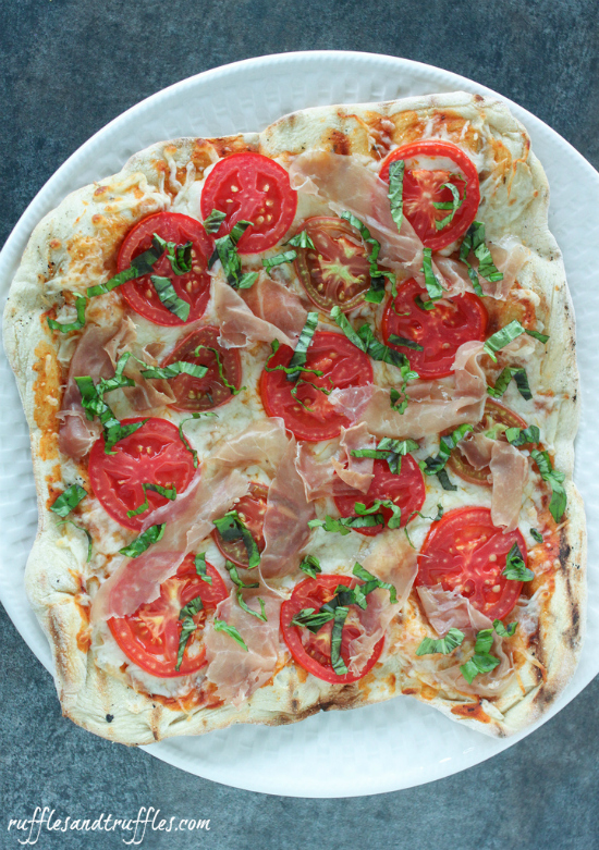 grilled pizza with tomato basil prosciutto