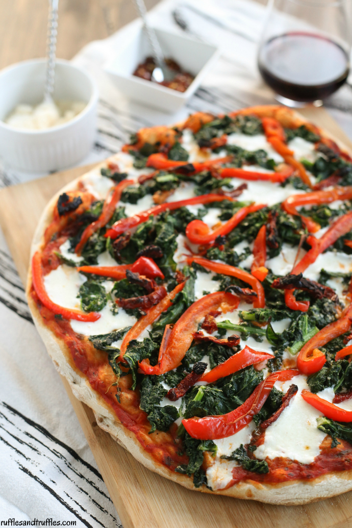 Grilled pizza with kale, roasted red peppers, and sundried tomatoes