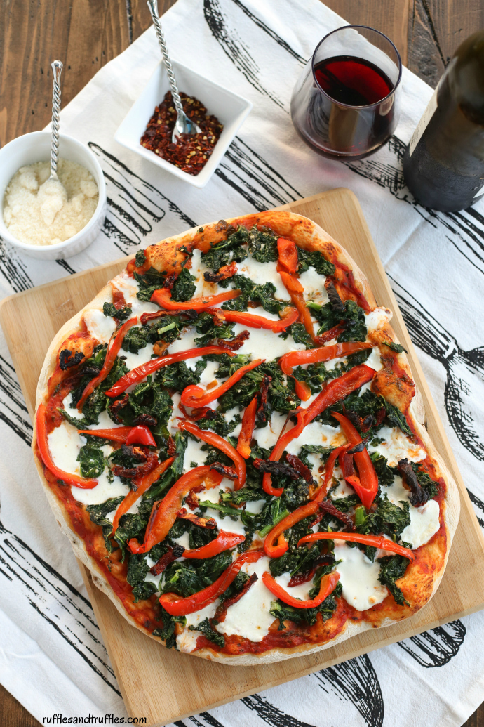 Grilled pizza with kale, roasted red peppers, and sundried tomatoes